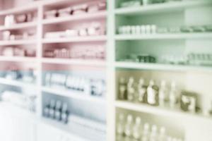 pharmacy shelves filled with medication blur background photo