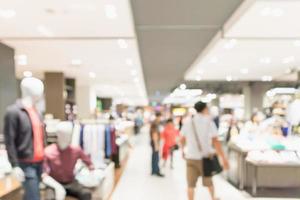 Abstract blur clothing boutique display interior of shopping mall background photo