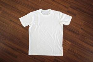 White t-shirt on wood background photo