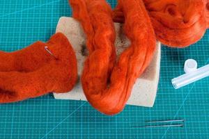 above view of material and tools for felt on mat photo