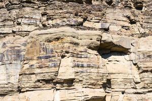 old layered rock in Caucasus mountains photo