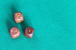 top view of three wooden dices with various points photo