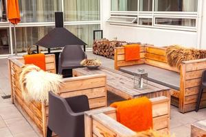 Outdoor restaurant terrace with wooden furniture photo