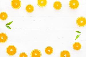 Fresh oranges pattern on white background photo
