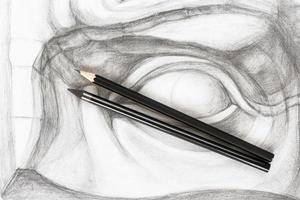 top view of different graphite pencils on drawing photo