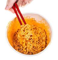 hand keeps red chopsticks with cooked noodles photo