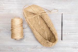 spool of hemp cord and hand-knitted bottom of bag photo