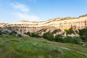 green meadow in gorge near Goreme town photo