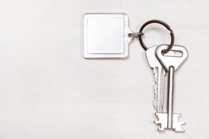 bunch of keys on keyring with blank white keychain photo