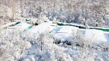 garages between park and apple orchard in winter photo