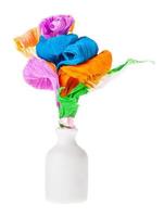 paper flowers in white ceramic bottle isolated photo