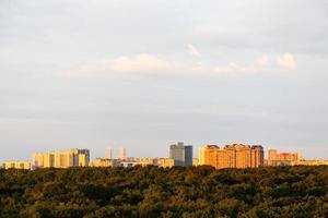 park and modern residential district on horizon photo