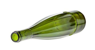 lying empty faceted green wine bottle isolated photo