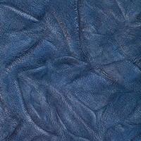 background from blue crumpled leather close up photo