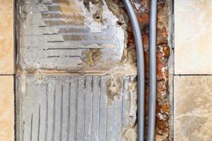 polyethylene water pipes inside brick wall at home photo