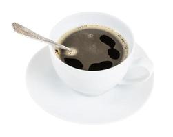chicory root tea in cup with spoon on saucer photo