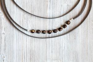 bone beads in necklace from leather strips photo