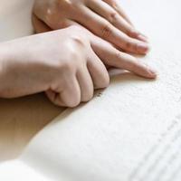 reading book with braille and usual text