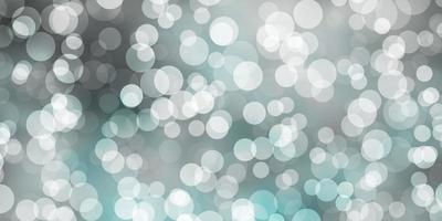 Light BLUE vector background with spots.