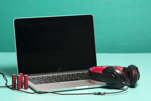 Red earphone on a notebook photo