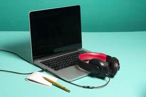 Red earphone on a notebook photo