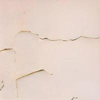computer generated seamless tile image of cracked plaster in light beige or eggshell. tiles seamlessly photo