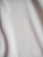 White sports jersey fabric texture background photo