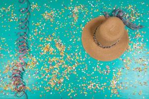 Background of confetti with elements related to the carnival and summer photo
