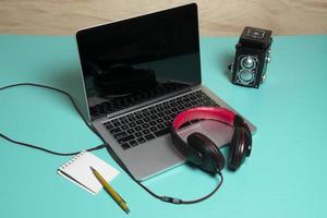 Red earphone on a notebook photo