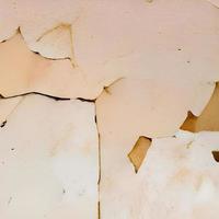computer generated seamless tile image of cracked plaster in light beige or eggshell. tiles seamlessly photo