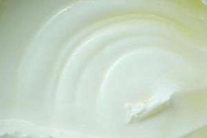 detail shot of fresh yogurt in a bowl on table photo