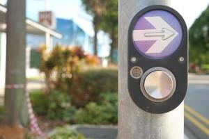 close up of crossing signal button in singapore photo