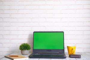 laptop with blank screen on office desk. photo