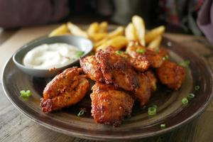 close up of slice of grill chicken on a plate photo