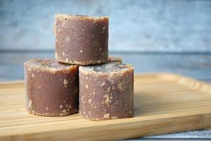 Jaggery traditional cane sugar cube on table photo