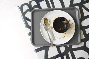 Empty plate after eating on table photo