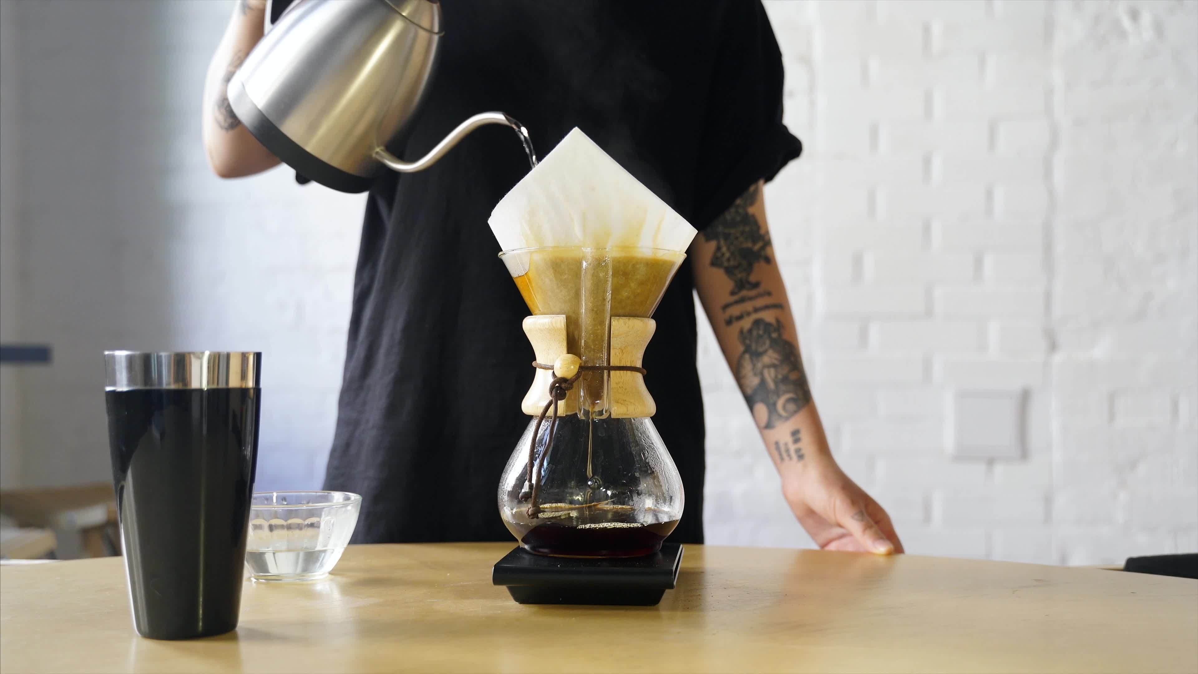 Brewing coffee in a glass coffee maker using the pour over method