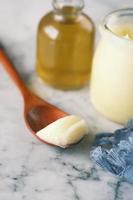 homemade ghee in container on a table , photo