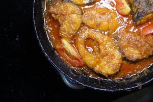 Close up of homemade indian curry fish. photo