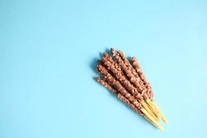 almond nut dark chocolate stick on table photo