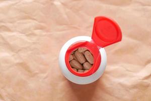 top view of medical pills in a container photo