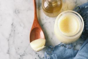 homemade ghee in container on a table , photo