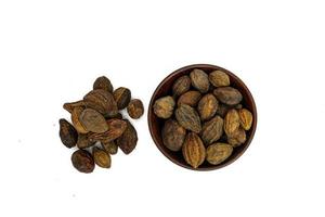 Organic Badi Harad fruit or Terminalia chebulaon white background photo