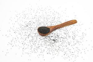 Nigella or black cumin with medicinal tulsi seeds on white background photo