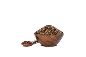 Indigofera or indigo seeds in wooden bowl photo