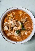 Taste the delicacy of Seblak, namely savory and spicy dishes from Indonesia. Seblak contains vegetables, squid, meatballs, sausage, crackers, eggs, and spices. Seblak is also easy to cook at home. photo