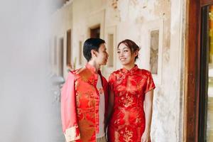 Happy young Asian couple in Chinese traditional dresses photo