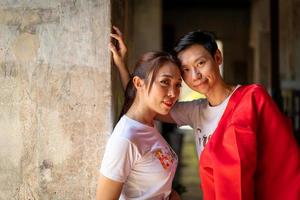 Happy young Asian couple in Chinese traditional dresses photo