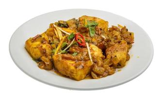 Fish masala on the plate and white background photo