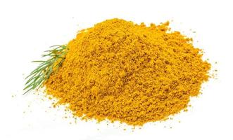 Curry powder on white background photo